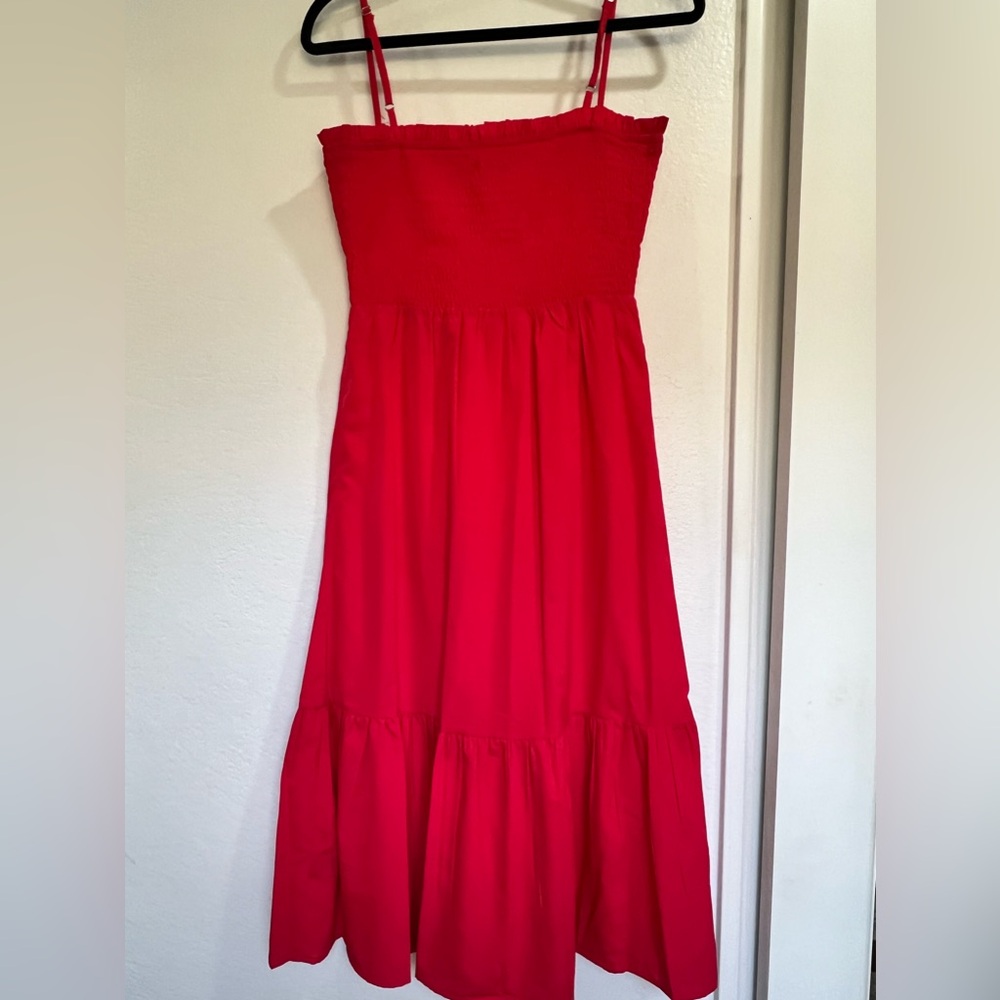 Red summer dress with spaghetti straps.